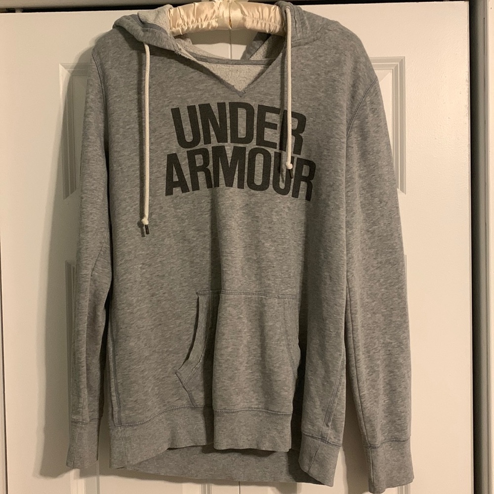 Grey under armor v-neck hoodie with middle pocket and name printed on front.